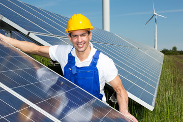 Photovoltaic engineer or installer installing solar panel