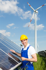 Engineer inspects solar panels at energy park
