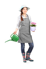 Female gardener holding a watering can