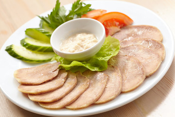 Slices of boiled beef tongue