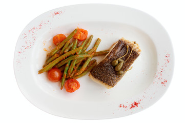 Cod fillet with runner beans isolated on white background