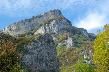 Mountains with cliffs and blue sky in Italy
