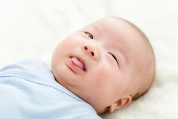 New born baby lick stick out