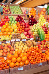 Naklejka na ściany i meble Shelf with fruits on farm market
