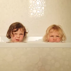  Portrait of kids in bathtub together © Morgan