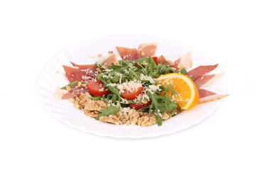 Salad with arugula and prosciutto.