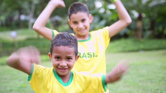 Two Brazilians supporters celebrate in the park