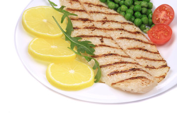 Grilled fish fillet with vegetables.