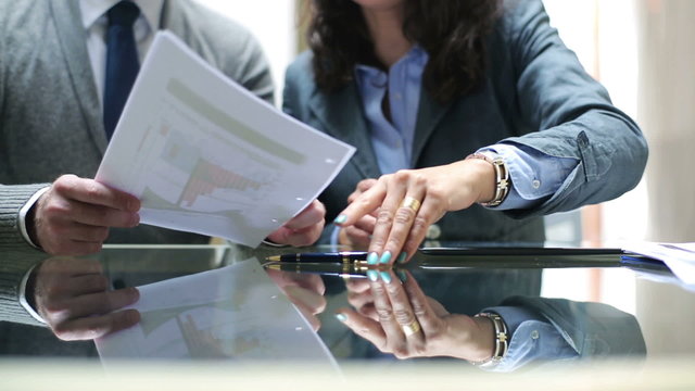 Businesswoman signing documents in the office