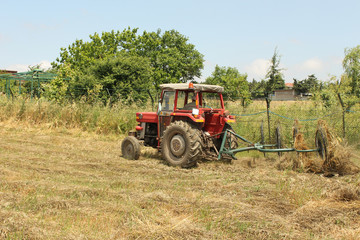 Obraz premium farming with old tractor