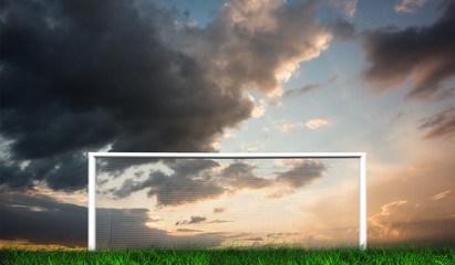 Football goal under cloudy sky