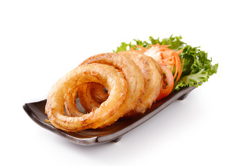 onion rings on a plate on white background