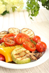 Delicious grilled vegetables on plate on table close-up