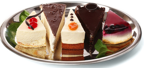 Assortment of pieces of cake, isolated on white © Africa Studio