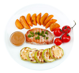 Grilled steak and grilled vegetables on plate, isolated on
