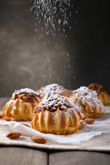 Tasty cakes on table on grey background