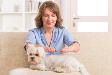 Woman practicing reiki therapy