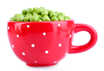 Fresh green peas in mug isolated on white background