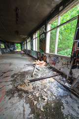 Fototapeta na wymiar Abandoned factory hall and windows