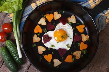 Egg and vegetables in the shape of heart