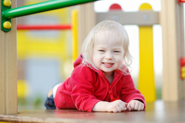 Little girl having fun at a playground