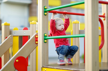 Little girl having fun at a playground