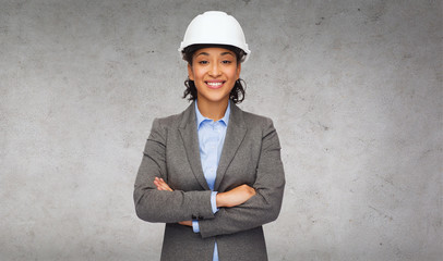 businesswoman in white helmet with crossed arms