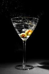 Martini Glass with Two Splashing Olives