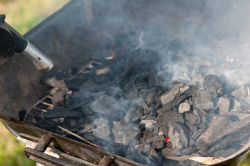 firing up the grill, kindling fire