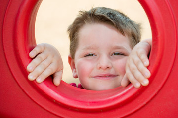 Portrait of young child playing on playground
