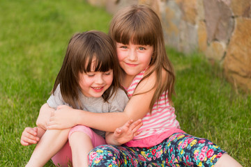 two small children on the grass