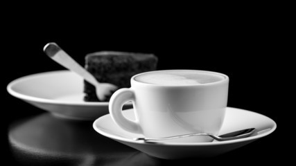 Black and white image of coffee and cake