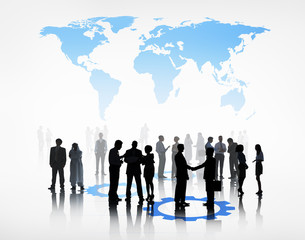 Group Of Business People Standing Beneath The World