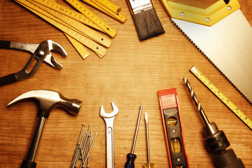 Assorted carpentry tools on wood