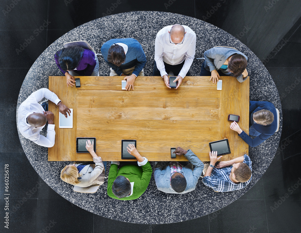 Poster group of diverse people in a table using devices
