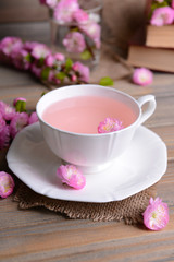 Beautiful fruit blossom with cup of tea