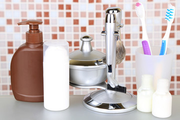 Male luxury shaving kit on shelf in bathroom