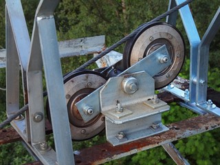 Steel pulley with hard rubber inserts, steel rope of cableway.