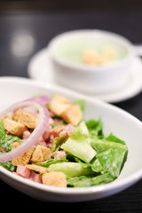 Closed up cropped bowl of caesar salad