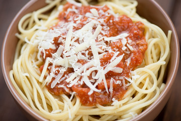 Close-up of spaghetti with bolognese sauce and parmesan