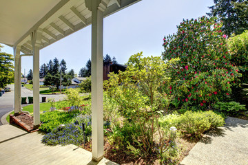 Entrance porch blooming flower bed