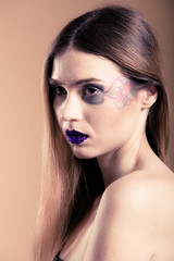 Fototapeta premium Girl woman with long straight hair and creative makeup