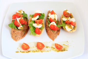 tapas with mozzarella and  cherry tomatoes