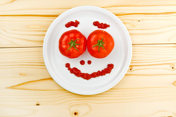 Fun food for children - tomatoes making smiley face