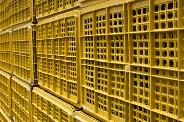 Background with plastic baskets stacked in the bazaar.