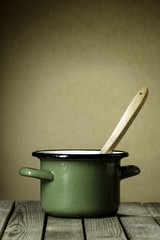 Rustic green enameled cooking pot