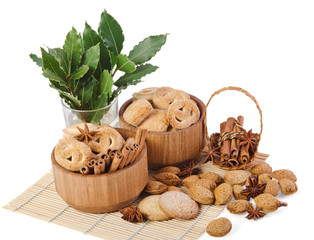 sweet sugar cookies in wooden containers with cinnamon sticks, a