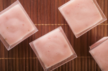 Strawberry pudding top view close up on wood
