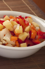 Raw vegetable cut in wooden background close up
