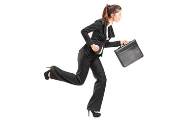 Businesswoman running with a briefcase